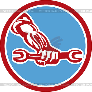 Mechanic Hand Holding Spanner Circle Retro - vector clipart