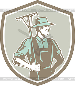 Organic Farmer Rake Shield Woodcut Retro - vector clip art