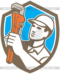 Plumber Holding Wrench Shield Retro - vector clipart