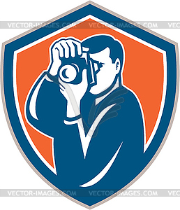 Photographer Aiming Camera Shield Retro - vector image