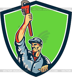 Plumber Raising Up Monkey Wrench Shield Retro - royalty-free vector clipart