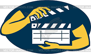 Hand Holding Movie Clapboard Oval Retro - vector image