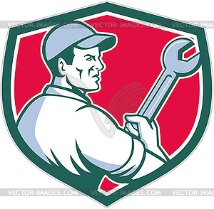 Mechanic Holding Monkey Wrench Shield Retro - vector clipart