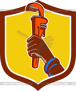 Black Plumber Hand Raising Monkey Wrench Crest - vector clip art