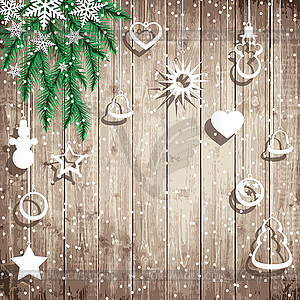 Fir tree branches and hanging toys on wooden board - vector clip art