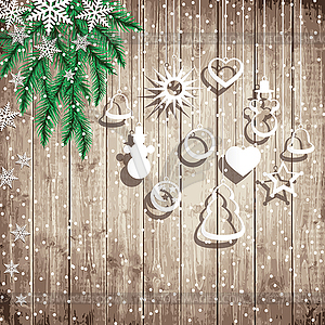 Fir tree branches and hanging toys on wooden board - royalty-free vector clipart