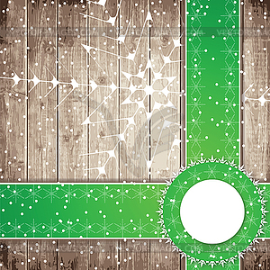 Green tapes and snowflakes on wooden board - vector clipart