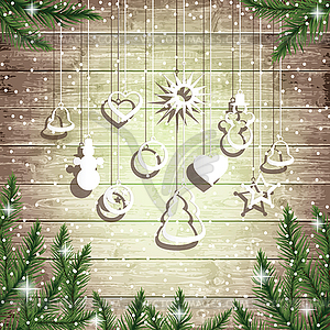 Fir tree branches and hanging toys on wooden board - vector image