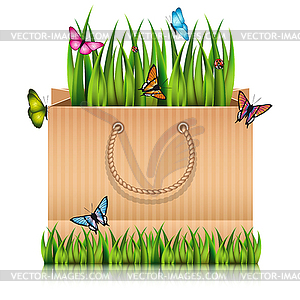 Paper shopping bag with fragment of grass - vector image