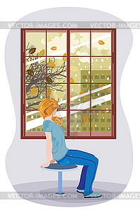 Girl looking to autumn city in window - vector clipart