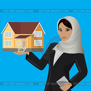 Beautiful arabic muslim woman with house on hand - vector clipart / vector image