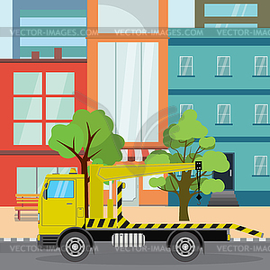Tow truck on city road.Houses,road and trees - vector image