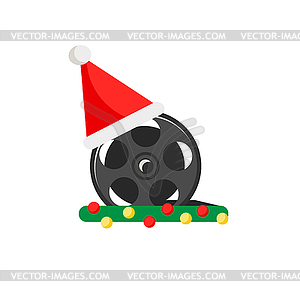 Film reel with red christmas santa hat , icon - vector image