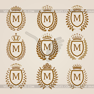 Golden shields with laurel wreath - vector clipart