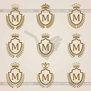 Golden shields with laurel wreath - vector clipart