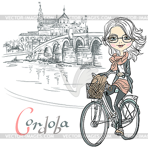 Cute girl rides bicycle in Cordoba - vector image