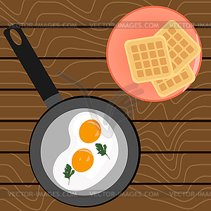 Scrambled eggs for breakfast and Belgian waffles - vector clip art