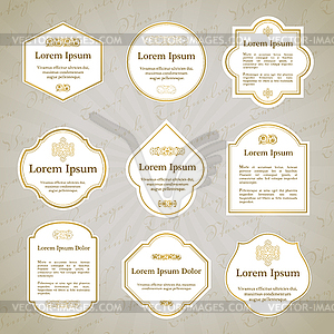 Set of elegant gold and white vintage labels - royalty-free vector image