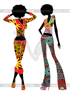 Two stylish slender ethnic women in pants - vector image