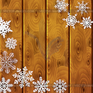 Christmas background with paper snowflakes on woode - vector clipart