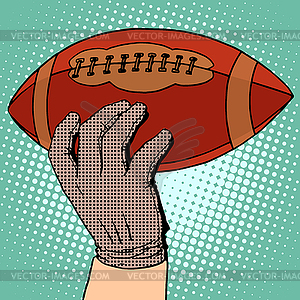 Ball of American football in his hand - vector clipart