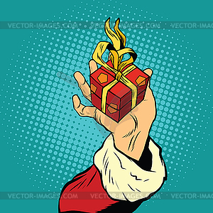 Hand of Santa Claus with gift - vector image