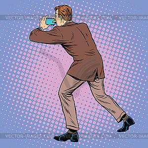 Man back photographed on smartphone - vector clipart