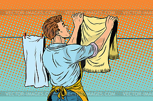 Vintage employee hangs up to dry clothes - vector clipart