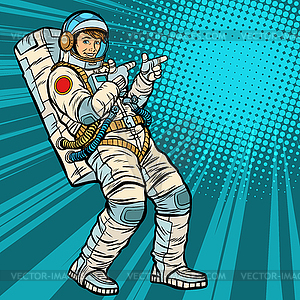 Astronaut young man points - vector clipart