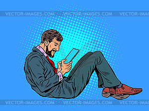 Man reads an electronic tablet - vector image