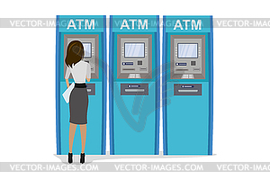 Cartoon young woman uses cash point automated ATM - vector clip art