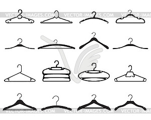 Black silhouettes of clothes hangers  - white & black vector clipart