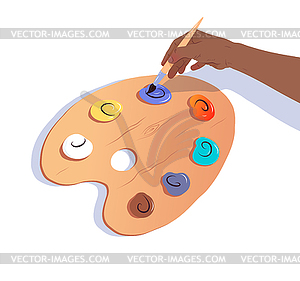 Hand with brush and paint palette - vector image