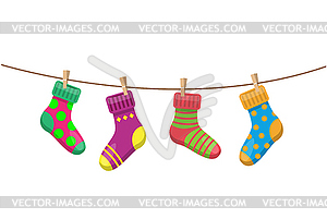 Socks hang on a rope - vector clipart