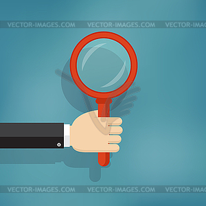 Hand holding magnifying glass - vector image