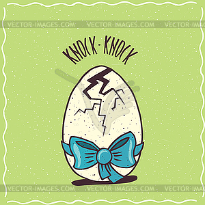 Cracked egg with blue ribbon - vector clipart