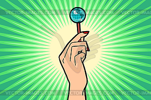 Earth Lollipop in female hand - vector image