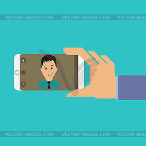 Умань рука мобильного телефона с лицом человека на - векторизованное изображение