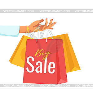 Hand holding paper sale bags - vector image