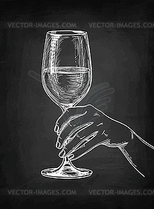 Hand holding glass of wine - vector clip art