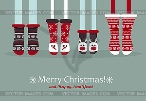 Family feet in Christmas socks - vector clipart