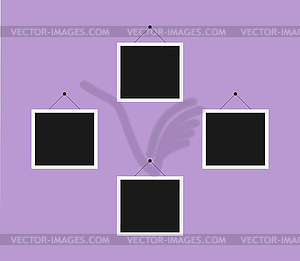 Photo frames hanging on the wall - vector EPS clipart